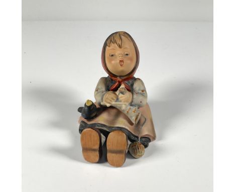 Hand painted porcelain figurine of a seated little girl with a black bird. Impressed marks 59 and 97. Backstamp in black West