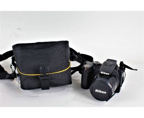 Nikon Coolpix P100 camera, with a Nikkor 26X Wide Optical Zoom 4.6-120mm f/2.8-5.0 lens, housed in a canvas bag&nbsp;