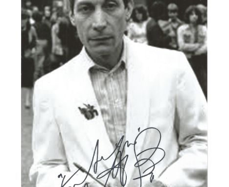 Charlie Watts signed 12x8 B/W photo, slightly grainy. Charlie Watts is best known as the drummer for the Rolling Stones. Good