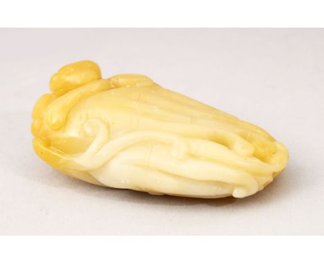 A GOOD 19TH / 20TH CENTURY CHINESE CARVED JADE FIGURE OF A MONKEY, carved with a monkey upon a finger citron, 7cm.