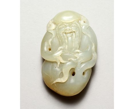 A GOOD CHINESE CARVED JADE PEBBLE OF SHOU LAO, the carving depicting shou lao god of longevity, 7.5cm x  5cm wide.
