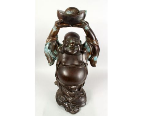 A GOOD 19TH CENTURY CHINESE BRONZE FIGURE OF BUDDHA, stood bearing an enchanting grin, the robes with signs of inlays, holdin