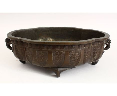 A GOOD 18TH / 19TH CENTURY CHINESE BRONZE CENSER, with carved decoration to the side in panels, with twin moulded chilong han