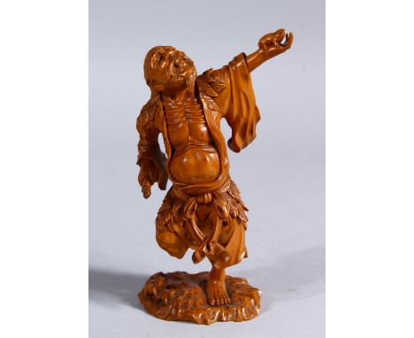 A GOOD JAPANESE LATE MEIJI PERIOD CARVED WOODEN OKIMONO OF GAMA SENIN, the okimono realistically carved to depict gama sennin