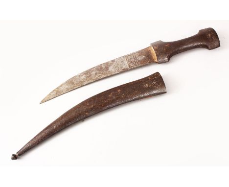 AN EARLY QAJAR STEEL DAGGER, the sheath carved with scrolling foliage, the blade with traces of silver inlay and calligraphy,