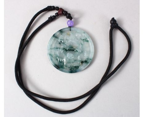 A GOOD LATE 20TH CENTURY CHINESE CARVED SPINACH JADE PENDANT, With circular ribbed design, complete with a certificate of aut