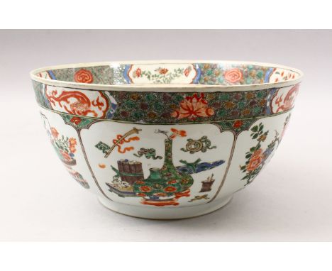 A 19TH CENTURY CHINESE FAMILLE VERTE PORCELAIN BOWL / BASIN, decorated with panel decoration depicting floral display and pre