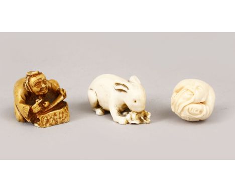 THREE JAPANESE LATE MEIJI PERIOD CARVED IVORY / BONE NETSUKE &amp; OJIME, the first netsuke of a hare grazing upon grape and 