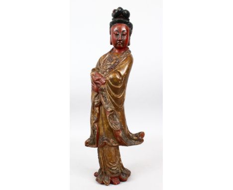 A GOOD 19TH CENTURY CHINESE CARVED WOOD &amp; POLY CHROME DECORATED FIGURE OF GUANYIN, stood in traditional attire and holdin