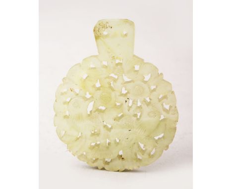 A GOOD 19TH / 20TH CENTURY CHINESE CARVED CLEAR JADE PENDANT, carved to depict floral and phoenix display, 7cm x 5.5cm