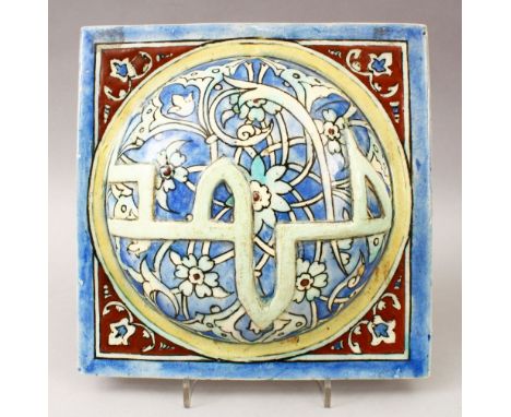 A GOOD IZNIK STYLE PORCELAIN TILE, decorated with scrolling foliage and raised calligraphy which proports to read 'Mohammad',