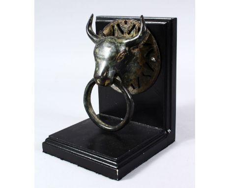 A GOOD 19TH CENTURY OR EARLIER CHINESE BRONZE DOOR KNOCKER OF AN OXEN / BULL, upon a mounted wooden stand, 18cm high overall,