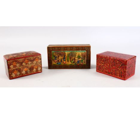 A 19TH / 20TH CENTURY PERSIAN PAINTED &amp; INLAID LIDDED BOX, depicting scenes of figures in garden settings, 4cm high x 16.