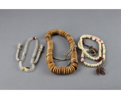 the first a very finely inlaid bone Mala, each bead inlaid with silver gold and turquoise, with two small bone Kapalas attach
