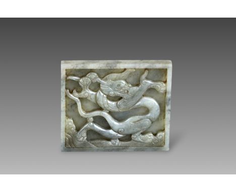 A Grey and Black Jade Dragon Belt Plaque, Ming dynasty, of rectangular form, well carved in relief against a flat countersunk