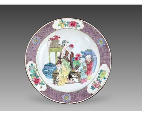 finely enamelled to the centre with a seated beauty with two boys, among flowers and antique jars, the everted rim with three