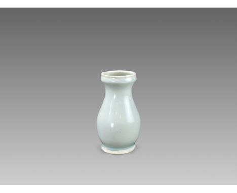 of baluster form, from splayed foot to compressed neck and galleried mouth rim, overall in translucent milky-blue glaze stopp