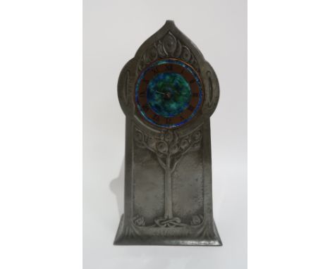 A DAVID VEASEY TREE OF LIFE PEWTER AND ENAMEL CLOCK MADE BY LIBERTY & CO circa 1903, the green/blue enamel dial with a copper