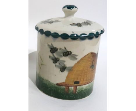 A WEMYSS WARE HONEY POT AND COVER painted with bees and a wicker hive, 16cm high Condition Report: honey pot restored cover. 