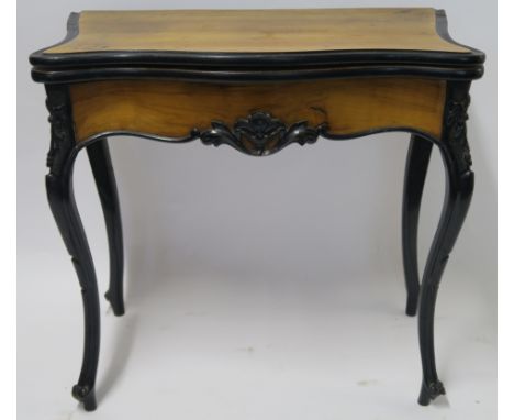 A CONTINENTAL WALNUT AND EBONISED FOLD OVER CARD TABLE, 78cm high, 82cm wide and 40cm deep Condition Report: Available upon r