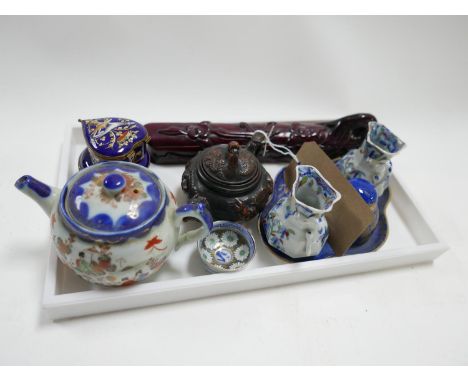 A collection of items to include two small Oriental teapots, two navy-blue enamel trinket and gilt metal trinket boxes (one m