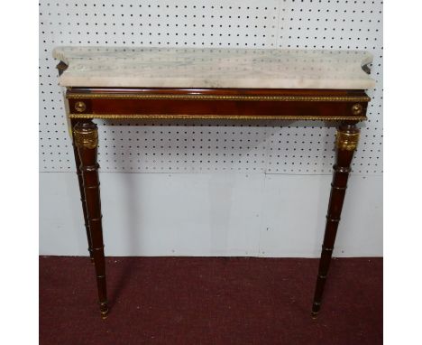 A Louis XVI style mahogany and gilt metal mounted console table, with variegated marble top, on turned tapered legs with bras