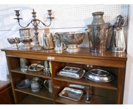 A collection of silver plated items to include a two branch candelabra, wine coolers, tureens, jugs, cutlery etc 