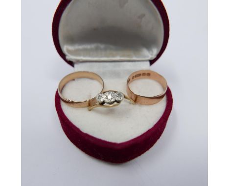 A red velvet heart-shaped box comprising of a 9ct rose gold band Size L, 1.3g, a 9ct yellow gold band Size Q 1.5g and 18ct an