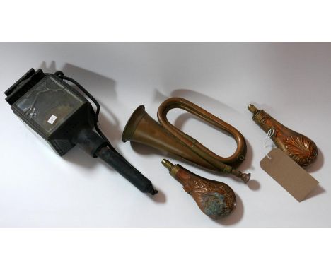 Two 19th century copper powder flasks together with a copper bugle and a stage coach lantern 