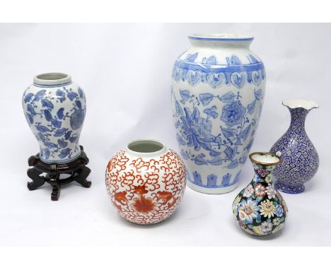 A collection of five vases to include three Chinese ceramic examples (one on a hardwood stand), a Chinese enamelled vase and 