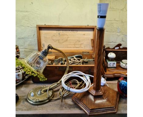 An Art Nouveau table lamp with adjustable shade and an oak table lamp base. 