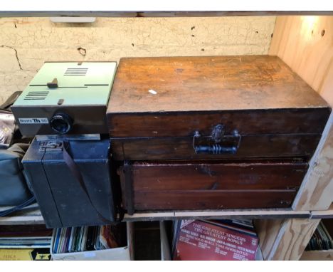 A Boots TH50 projector, a milliamp, a type of projector in case and a screen printing kit. 