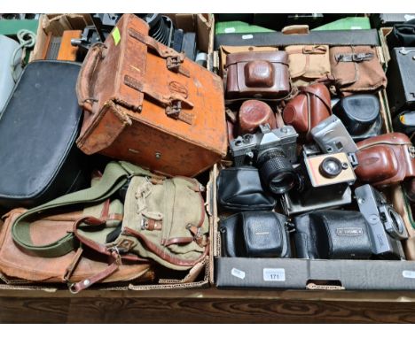 Two boxes of cameras and camera equipment including Bell &amp; Howell Filmo 70 cine camera, Polaroid, Praktica etc.