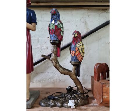 A leaded glass lamp modelled as two parrots. 