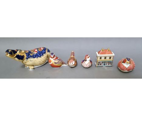 6 Crown Derby pieces to include hippo, 1 china shop and 4 birds, 4 with gold stoppers, 1 ceramic and 1 silver. 