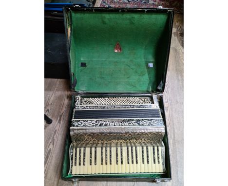 A vintage piano accordian, made by Scandalli, Camerano, Italia, in case.