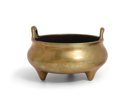 A BRONZE INCENSE BURNERChina, Qing dynasty, 18th/19th centuryThe ovoid body supported on three short feet, a pair of handles 