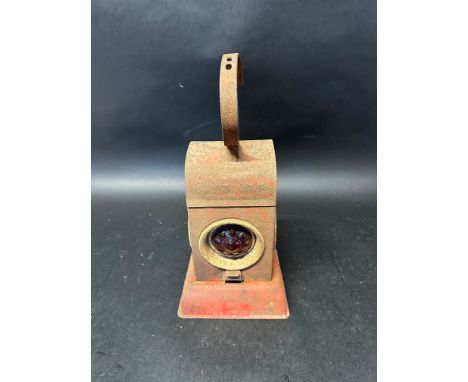 An Akenco road lamp marked EGAS with integral burner and three red ball glasses. 