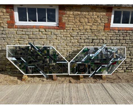 A pair of large stained glass panels commissioned to commemorate the opening of BP House by Sir Peter Walters on 2nd June 198