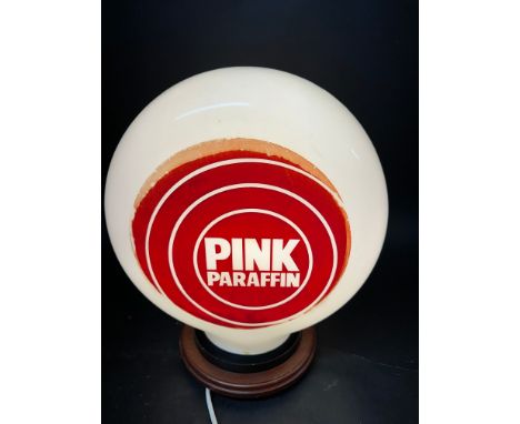 A Pink Paraffin glass petrol pump globe, pink faded and one very, very minor chip to neck. 