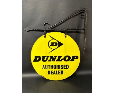 A Dunlop Authorised Dealer circular double sided enamel advertising sign on hanging bracket, 21 1/4 x 26" overall. 