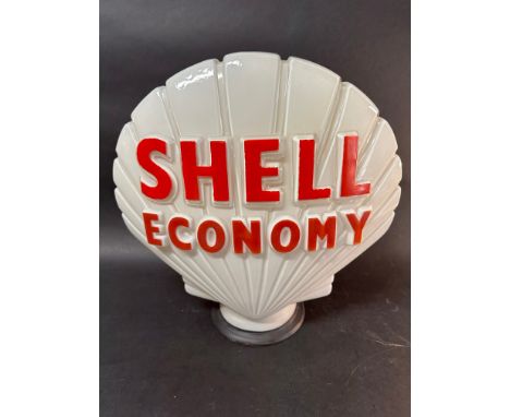 A 'Shell Economy' glass petrol pump globe stamped Hailware. Shell wording repainted.