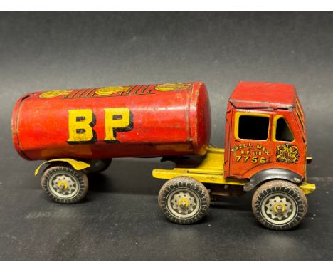 A Wells Brimtoy tinplate clockwork Albion style articulated petrol tanker with Shell Mex and BP Ltd. livery, no. 7756, yellow