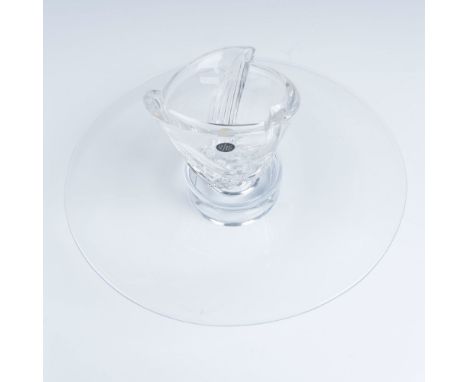 An elegant duo featuring a candle holder with cut curved lines and a sleek clear cake stand. Rosenthal sticker on candle hold