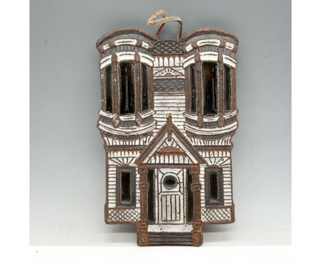 Handmade ceramic building colored in brown, white and black with cork backing. Victorian Littlejohn Ceramics backstamp. Issue