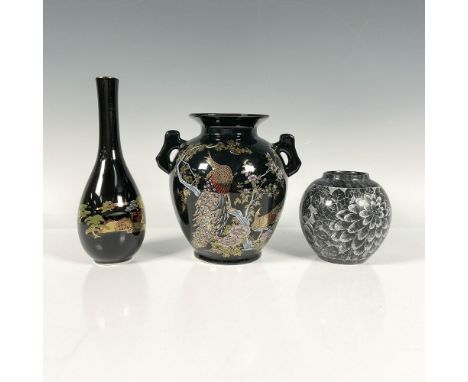 A set of three elegant black vases, including a black bud vase with gilded accents featuring art of a bonsai garden, a two ha