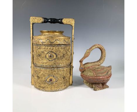 This stunning set includes a beautifully ornate gold-toned wooden tiffin box with two compartments and a handle, adorned with