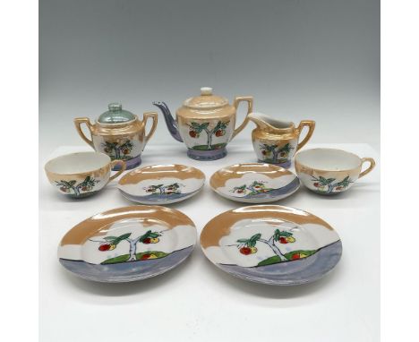 Lovely set with amber, blue and lavender luster glaze over white porcelain, designed with apple tree. Set includes teapot wit