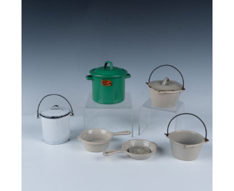 Includes a 5 piece beige cast iron enamel set of two skillets, a pot with a handle, a lidded pot with a handle and an oven tr