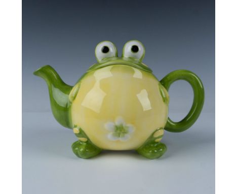 Whimsical teapot of Toby the frog perfect for use or display. Pot features raised set of eyeballs that serves as a lid handle